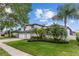 Beautiful two-story home with lush landscaping and well-maintained lawn at 1559 Wescott Loop, Winter Springs, FL 32708
