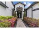 Inviting front entrance with a decorative glass door and manicured landscaping at 1559 Wescott Loop, Winter Springs, FL 32708