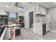 Bright home office with custom cabinets, a wet bar, and an adjacent bathroom at 1559 Wescott Loop, Winter Springs, FL 32708