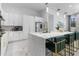 Bright kitchen features modern appliances, a large island with seating, and white cabinetry at 1559 Wescott Loop, Winter Springs, FL 32708