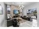 Bright living room featuring a fireplace, large windows, and an open concept design at 1559 Wescott Loop, Winter Springs, FL 32708