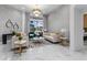 Bright living room with marble floors, stylish seating, and a modern chandelier at 1559 Wescott Loop, Winter Springs, FL 32708