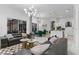Open-concept living room flows into dining area with elegant furnishings and marble flooring at 1559 Wescott Loop, Winter Springs, FL 32708