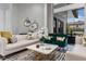 Stylish living room features designer wallpaper, modern furniture, and open patio doors at 1559 Wescott Loop, Winter Springs, FL 32708