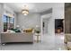 Spacious living room with a modern chandelier, neutral decor, and access to outdoor spaces at 1559 Wescott Loop, Winter Springs, FL 32708