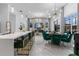 Open concept living space with modern fireplace and eat in kitchen at 1559 Wescott Loop, Winter Springs, FL 32708
