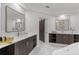 Bathroom with double vanity, vessel sinks, marble countertop, modern fixtures, and sliding barn door at 1559 Wescott Loop, Winter Springs, FL 32708
