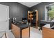 Office featuring a modern desk, built-in shelving, and natural light at 1559 Wescott Loop, Winter Springs, FL 32708