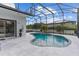 Backyard pool surrounded by a screened enclosure, blending leisure with serene outdoor living at 1559 Wescott Loop, Winter Springs, FL 32708