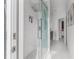 Contemporary bathroom showcasing a glass shower with a rainfall showerhead, and white marble tile at 1559 Wescott Loop, Winter Springs, FL 32708