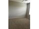 Spacious bedroom with soft neutral carpet, bright window and large walls perfect for decor at 1723 Post Oak Dr, Davenport, FL 33837