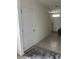 Light and bright entryway with tile flooring and white doors at 1723 Post Oak Dr, Davenport, FL 33837