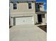 Charming two-story home with a two car garage, neutral paint and well maintained lawn at 1723 Post Oak Dr, Davenport, FL 33837