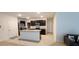 Modern kitchen with stainless steel appliances and a large island at 1723 Post Oak Dr, Davenport, FL 33837