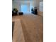 Spacious carpeted living room with sliding glass door and ample natural light at 1723 Post Oak Dr, Davenport, FL 33837