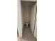 Small toilet room features tile flooring, white toilet and a white door, perfect for added privacy at 1723 Post Oak Dr, Davenport, FL 33837