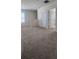 Spacious upstairs landing with neutral carpet, white trim, and a bright, airy feel at 1723 Post Oak Dr, Davenport, FL 33837