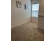 Cozy upstairs landing area with neutral carpet, natural lighting and nice clean white walls at 1723 Post Oak Dr, Davenport, FL 33837