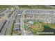 Community aerial view showing a pool, tennis courts, bocce ball court, a playground, and a lake at 2019 Spring Shower Cir, Kissimmee, FL 34744