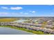 An aerial view of the community showcasing the lakes, landscaping, and residential area at 2019 Spring Shower Cir, Kissimmee, FL 34744