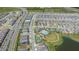 Community aerial view showing a pool, tennis courts, bocce ball court, a playground, and a lake at 2019 Spring Shower Cir, Kissimmee, FL 34744
