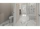 Well-designed bathroom with marble shower and an adjoining toilet room at 2019 Spring Shower Cir, Kissimmee, FL 34744