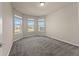 A cozy bedroom featuring carpet floors, neutral paint and plenty of sunlight at 2019 Spring Shower Cir, Kissimmee, FL 34744