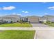Beautiful one-story home with a well-maintained lawn and paved driveway at 2019 Spring Shower Cir, Kissimmee, FL 34744