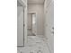 Hallway showcasing marble floors and modern white doors at 2019 Spring Shower Cir, Kissimmee, FL 34744