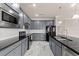 Well-equipped kitchen featuring stainless steel appliances and stylish gray cabinetry at 2019 Spring Shower Cir, Kissimmee, FL 34744