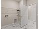 Practical laundry room featuring modern marble floors and white door at 2019 Spring Shower Cir, Kissimmee, FL 34744