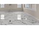 Bright living room featuring stylish marble flooring and plenty of natural light at 2019 Spring Shower Cir, Kissimmee, FL 34744