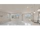 Open living space with marble floors, lots of windows and recessed lighting at 2019 Spring Shower Cir, Kissimmee, FL 34744
