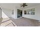 Covered patio with brick flooring and sliding glass doors leading into the home at 2019 Spring Shower Cir, Kissimmee, FL 34744
