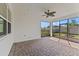 Covered patio featuring brick flooring, ceiling fan, and views of the backyard at 2019 Spring Shower Cir, Kissimmee, FL 34744