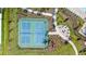 Overhead view of community pickleball courts, firepit, landscaping, and sidewalks in a well-kept neighborhood at 2019 Spring Shower Cir, Kissimmee, FL 34744