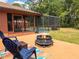 Inviting backyard patio with fire pit, screened pool, and ample seating for outdoor entertaining at 20249 Macon Pkwy, Orlando, FL 32833