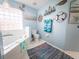 Bathroom with a soaking tub, toilet, and nautical decorations creating a serene atmosphere at 20249 Macon Pkwy, Orlando, FL 32833