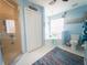 Relaxing bathroom with a glass-enclosed shower, soaking tub, and beach-inspired decor at 20249 Macon Pkwy, Orlando, FL 32833