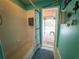 Inviting bathroom featuring a tub with shower, coastal decor, and direct access to a screened-in pool area at 20249 Macon Pkwy, Orlando, FL 32833