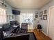 Cozy home office area in bedroom with a desk and views of the screened patio and pool at 20249 Macon Pkwy, Orlando, FL 32833