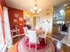 Charming dining room featuring a round table, elegant chandelier, and stylish decor accents at 20249 Macon Pkwy, Orlando, FL 32833