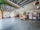 Spacious garage area offering ample storage and parking with an open door and gray epoxy floors at 20249 Macon Pkwy, Orlando, FL 32833