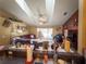 Open living room features fan, vaulted ceilings, decor, slider doors to patio, and view to the kitchen at 20249 Macon Pkwy, Orlando, FL 32833