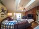Comfortable living room with fan, vaulted ceilings, decor, slider doors to patio, and view to the kitchen at 20249 Macon Pkwy, Orlando, FL 32833