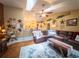 Spacious living room features fan, vaulted ceilings, decor, and a view to the kitchen area at 20249 Macon Pkwy, Orlando, FL 32833