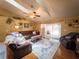 Bright open living room with fan, vaulted ceilings, comfortable furniture, decor, and access to patio at 20249 Macon Pkwy, Orlando, FL 32833