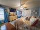 Serene main bedroom with nautical decor, a ceiling fan, and a comfortable bed at 20249 Macon Pkwy, Orlando, FL 32833
