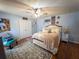 Bright main bedroom with a neutral color palette, ceiling fan, and a cozy rug at 20249 Macon Pkwy, Orlando, FL 32833