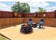 Outdoor patio with a fire pit, chairs, and bamboo privacy screening, perfect for relaxing and entertaining at 20249 Macon Pkwy, Orlando, FL 32833